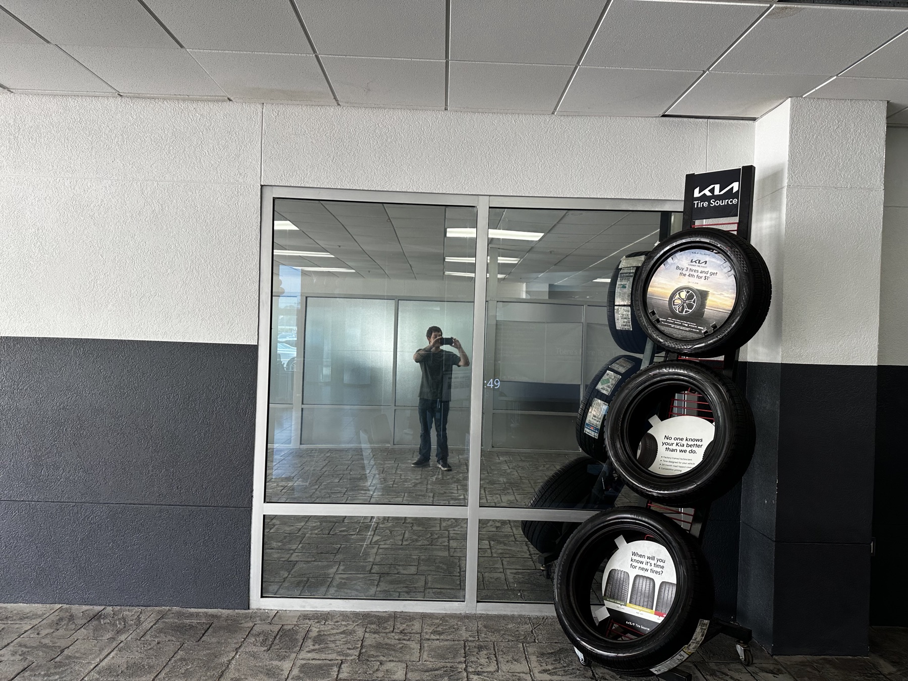 The same office window after reflective film, now mirroring the service bay